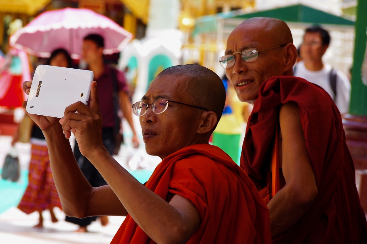 Monks at the Shwedagon Pagoda in Yangon, Myanmar.
